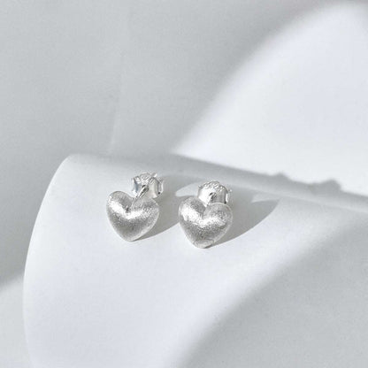 Small brushed silver heart earrings in 925 silver.