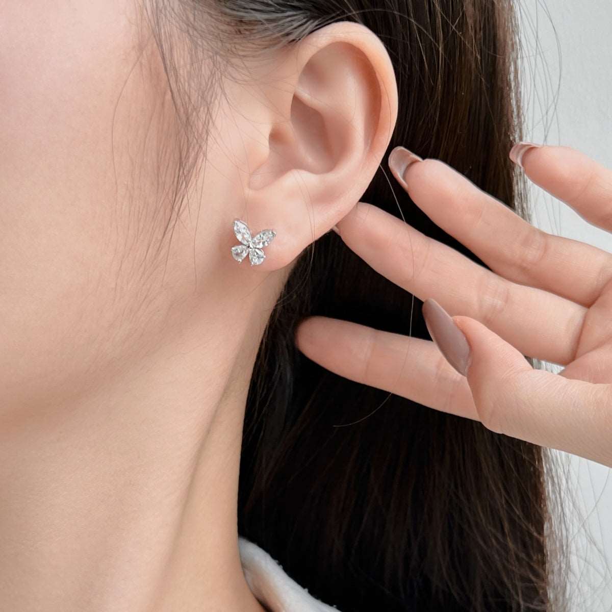 Cute butterfly-shaped stud earrings made of high-quality 925 sterling silver, adorned with 5A Cubic Zirconia, perfect for adding charm and elegance to any look.