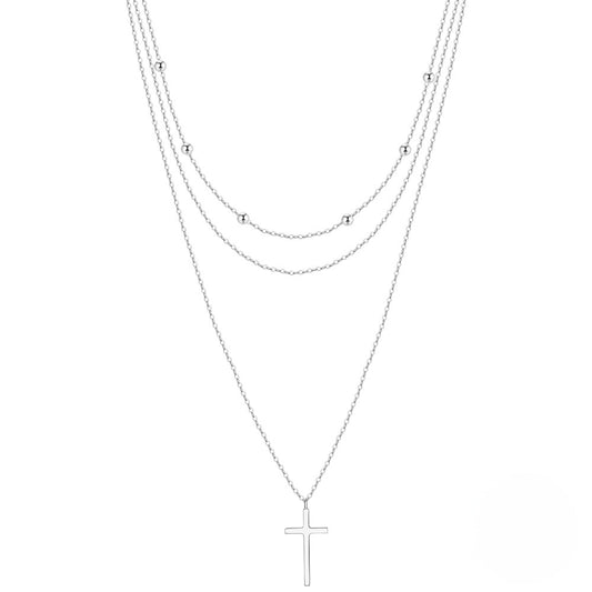 Triple layered silver necklace with cross pendant in two colors.