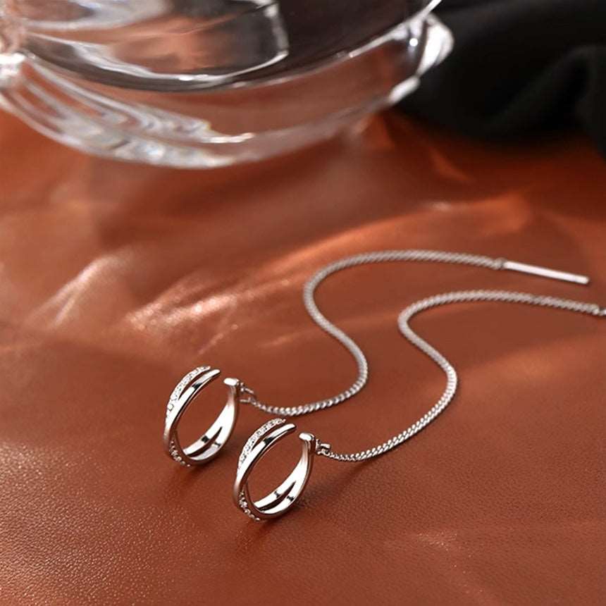 Side angle view of Earcuff Chain Drop Earrings, highlighting the stylish earcuff design and chain drop feature.