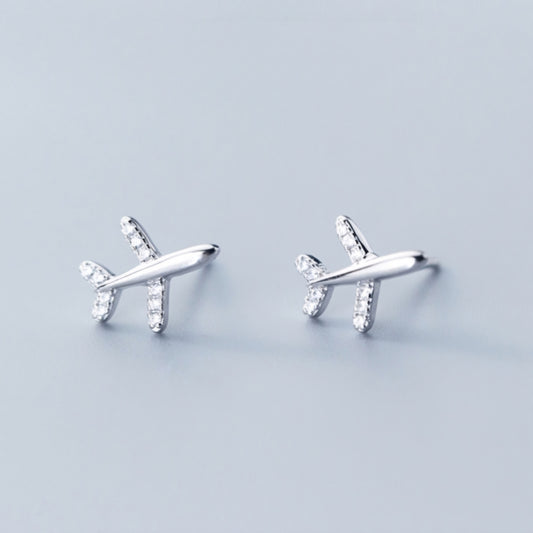 Close-up view of Fly High Airplane Stud Earrings, highlighting the intricate details of the sterling silver and sparkling cubic zirconia.