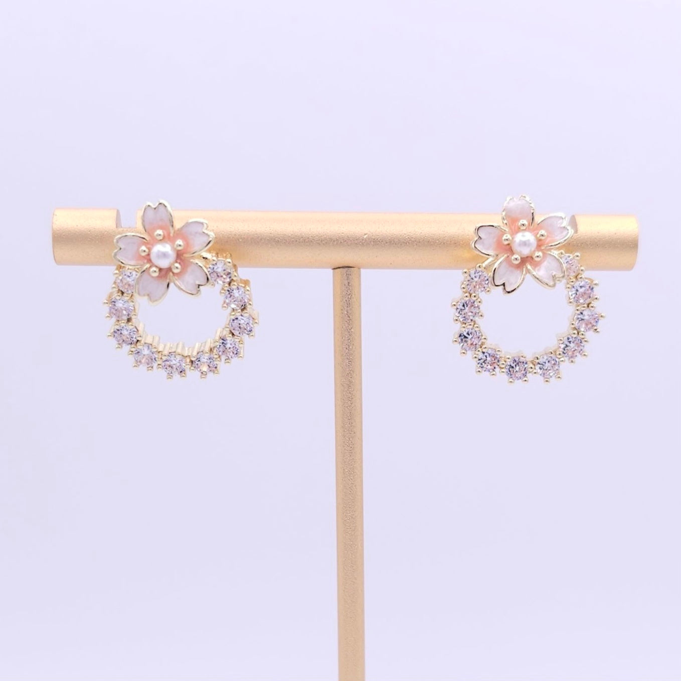 Front view of the Flower Wreath Stud Earrings displaying the feminine design with cherry blossom details, ideal for everyday wear and elegant outfits.