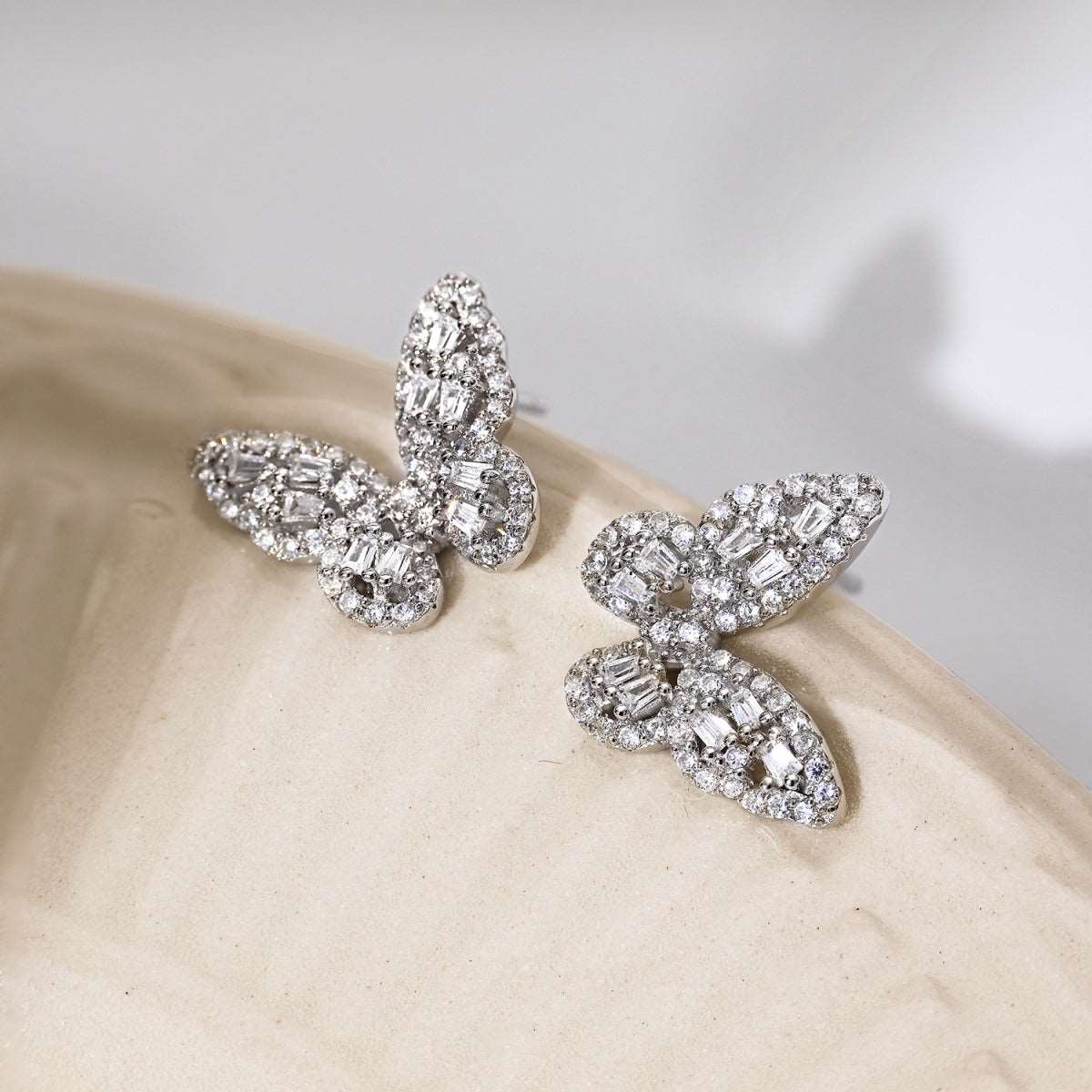 Close-up image of the Grace Butterfly Earrings, detailing the sparkling cubic zirconia and the delicate textures of the butterfly design.