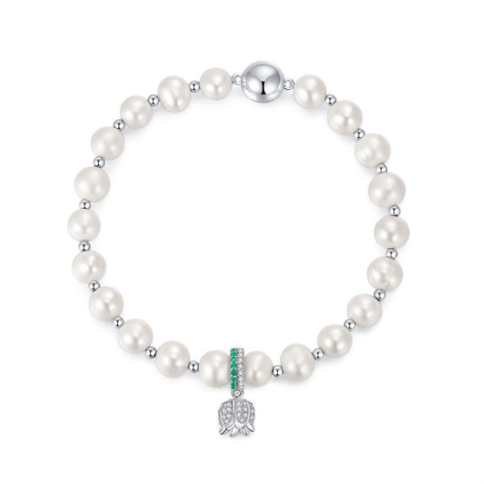 Elegant pearl bracelet adorned with a lily of the valley pendant, crafted from high-quality 925 silver, featuring 5A cubic zirconia and freshwater pearls, and finished with rhodium plating.