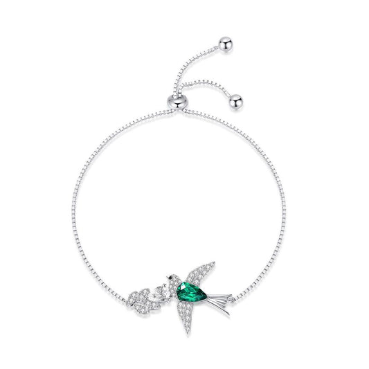 Stunning bracelet featuring a charming little bird pendant crafted from beautiful green Austrian crystal, made with high-quality 925 silver and rhodium plating for lasting shine.