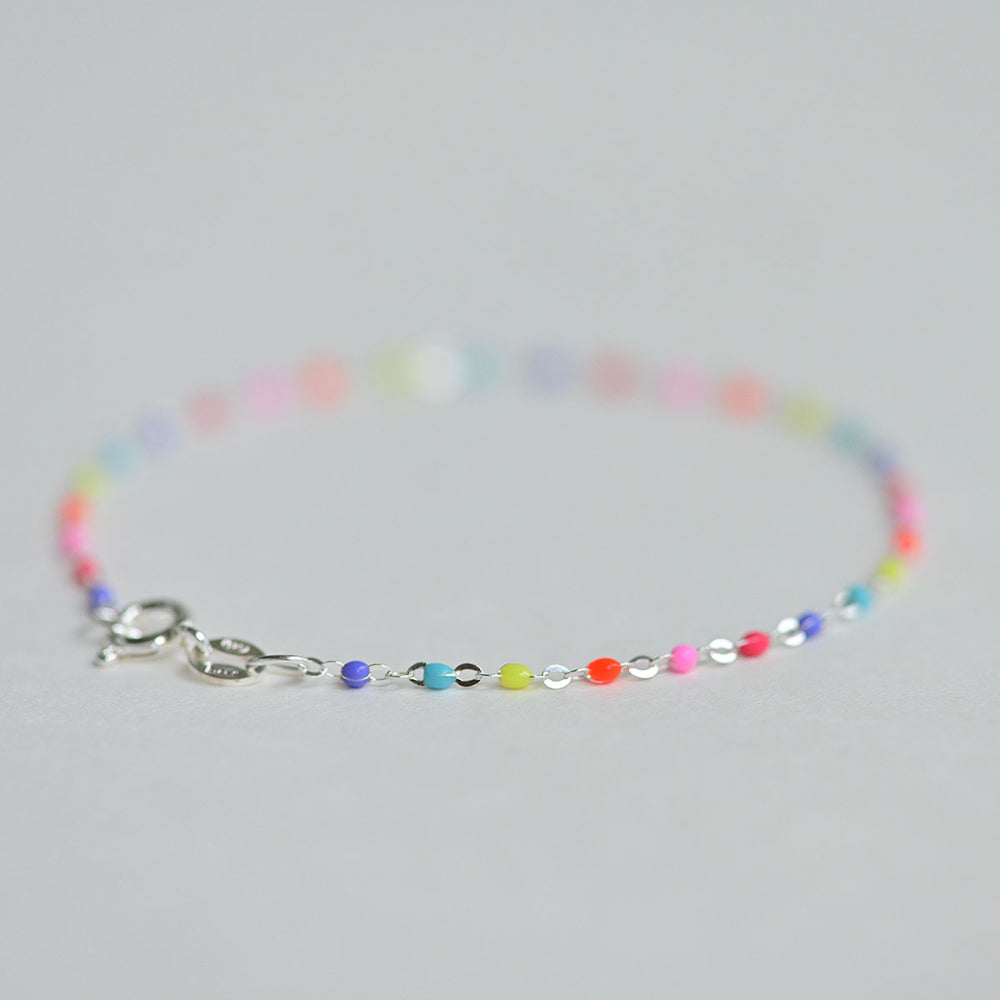 Colorful rainbow anklet made in Italy from silver, designed for kids.