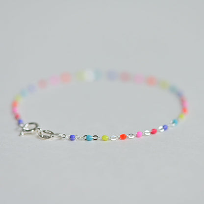 Colorful rainbow anklet made in Italy from silver, designed for kids.