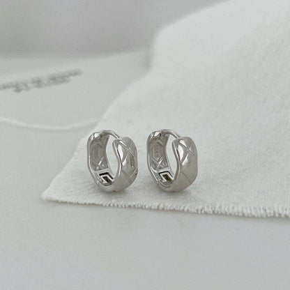 Front view of silver Embossing Huggie Earrings showcasing the embossed texture and 925 silver rhodium plating.