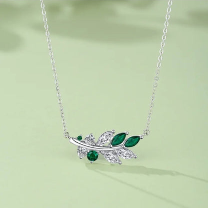 Elegant bay leaves motif crystal pendant necklace crafted from high-quality 925 silver, adorned with sparkling cubic zirconia and beautiful crystals, finished with luxurious rhodium plating.