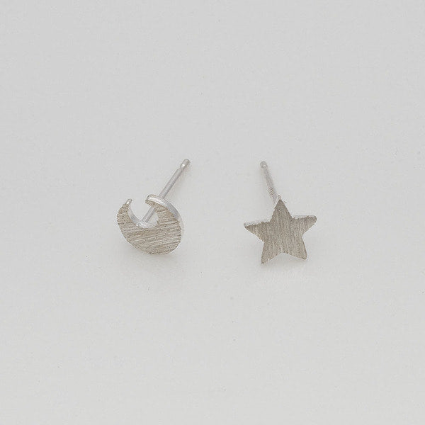 Brushed silver moon and star stud earrings in 925 silver.