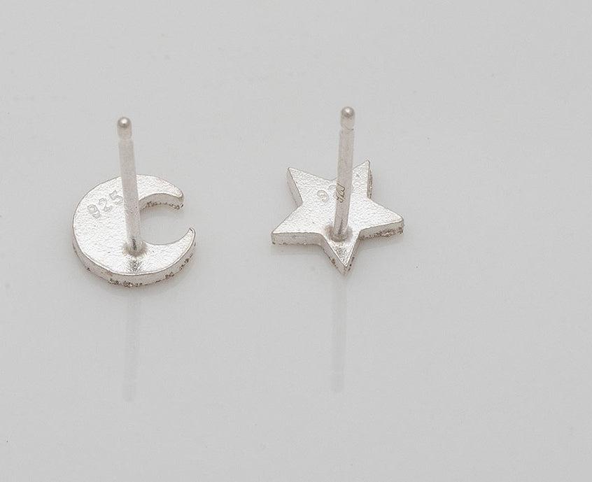 Brushed silver moon and star stud earrings in 925 silver.