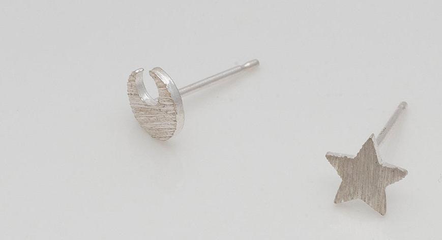 Brushed silver moon and star stud earrings in 925 silver.